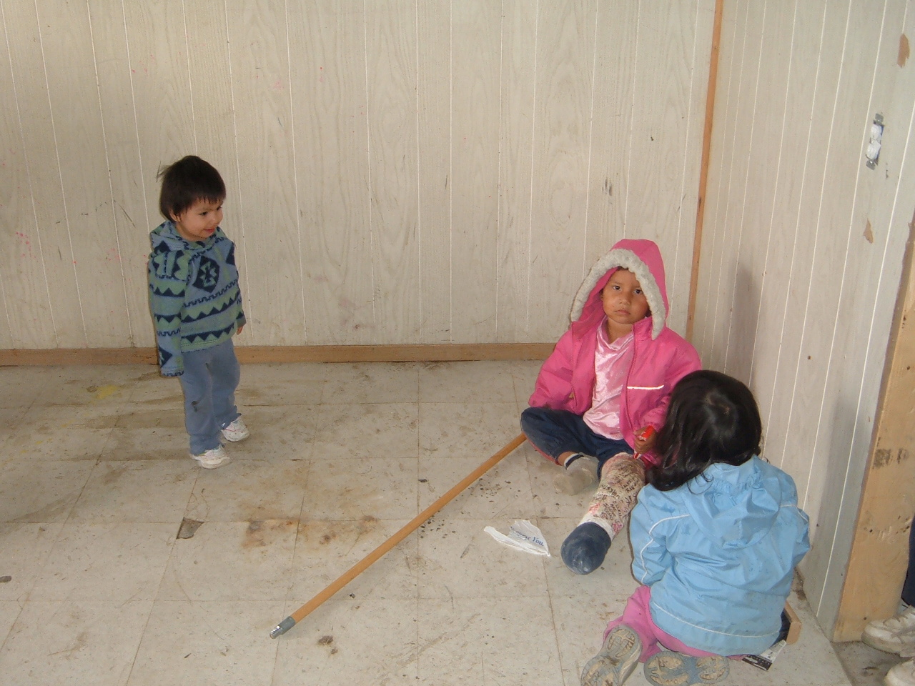 Little kids playing on the floor