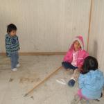 Little kids playing on the floor