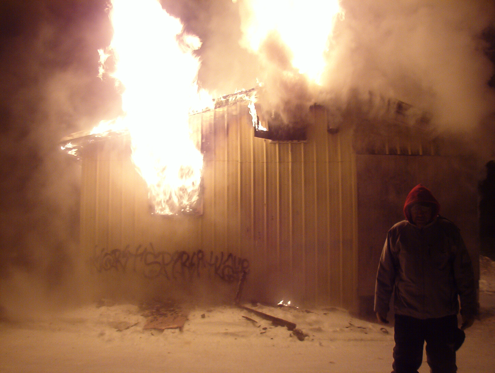 Danni Rae stands by as the band office burns