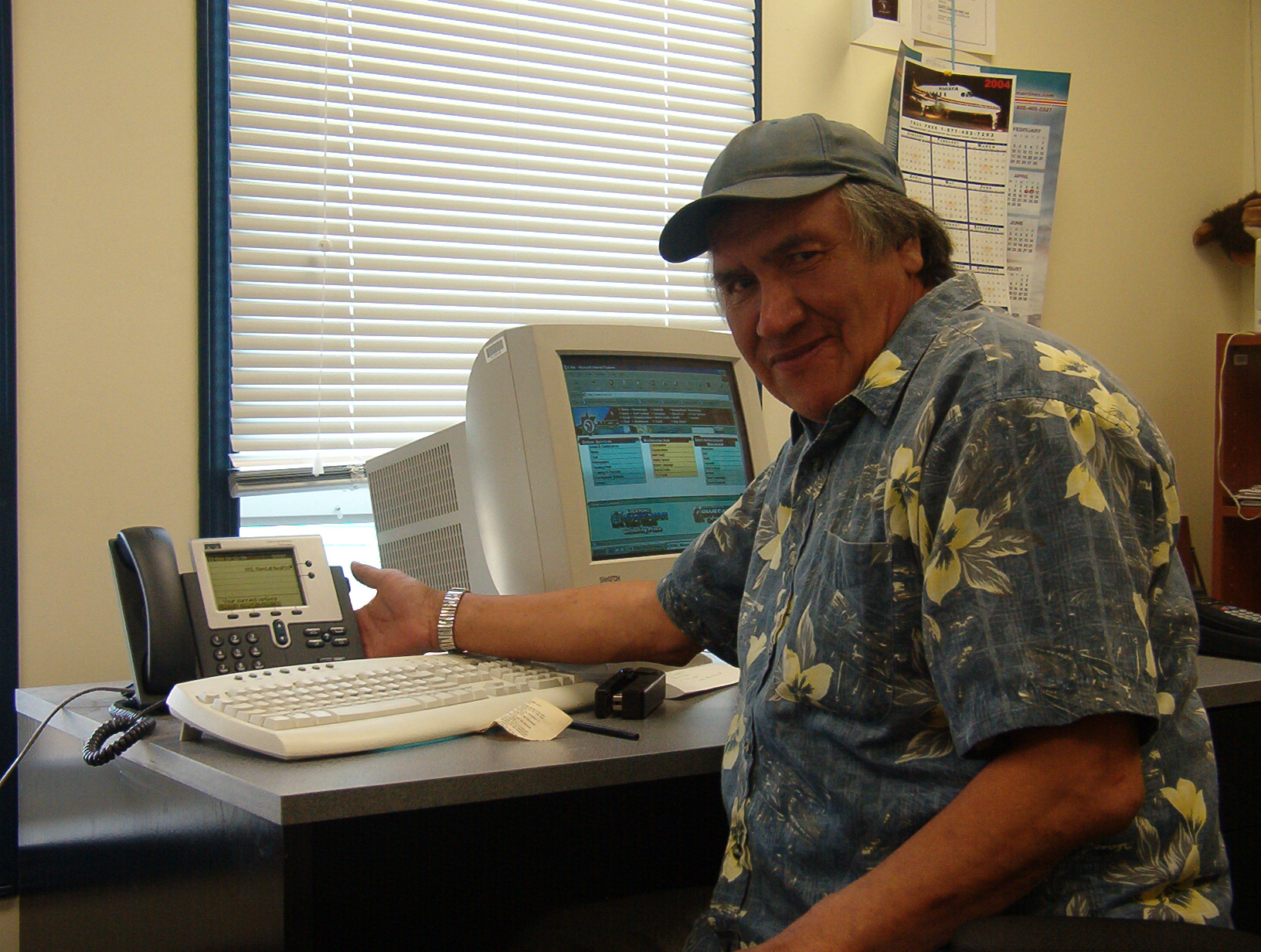 Luke Rae, our, Mental Health Worker.  Here he poses for a picture with his new IP phone.