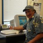 Luke Rae, our, Mental Health Worker.  Here he poses for a picture with his new IP phone.