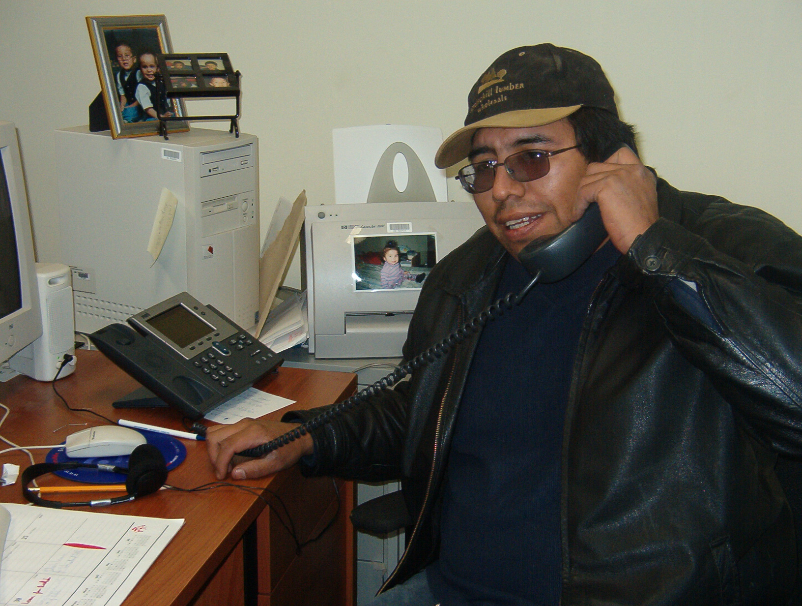 Homer Meekis, Health Director, for the Clinic in North Spirit Lake, poses for a picture with his IP phone.