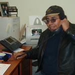 Homer Meekis, Health Director, for the Clinic in North Spirit Lake, poses for a picture with his IP phone.
