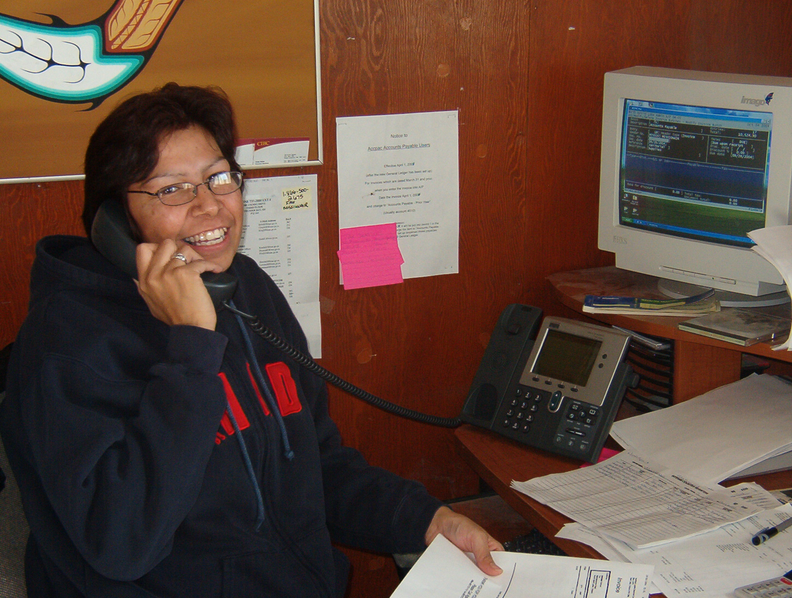 And at the Band Office, Donna Campbell
poses for a picture with her new IP
phone.