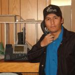 Shayne Rae, Post master for the Band Office, poses for a picture with his IP phone.