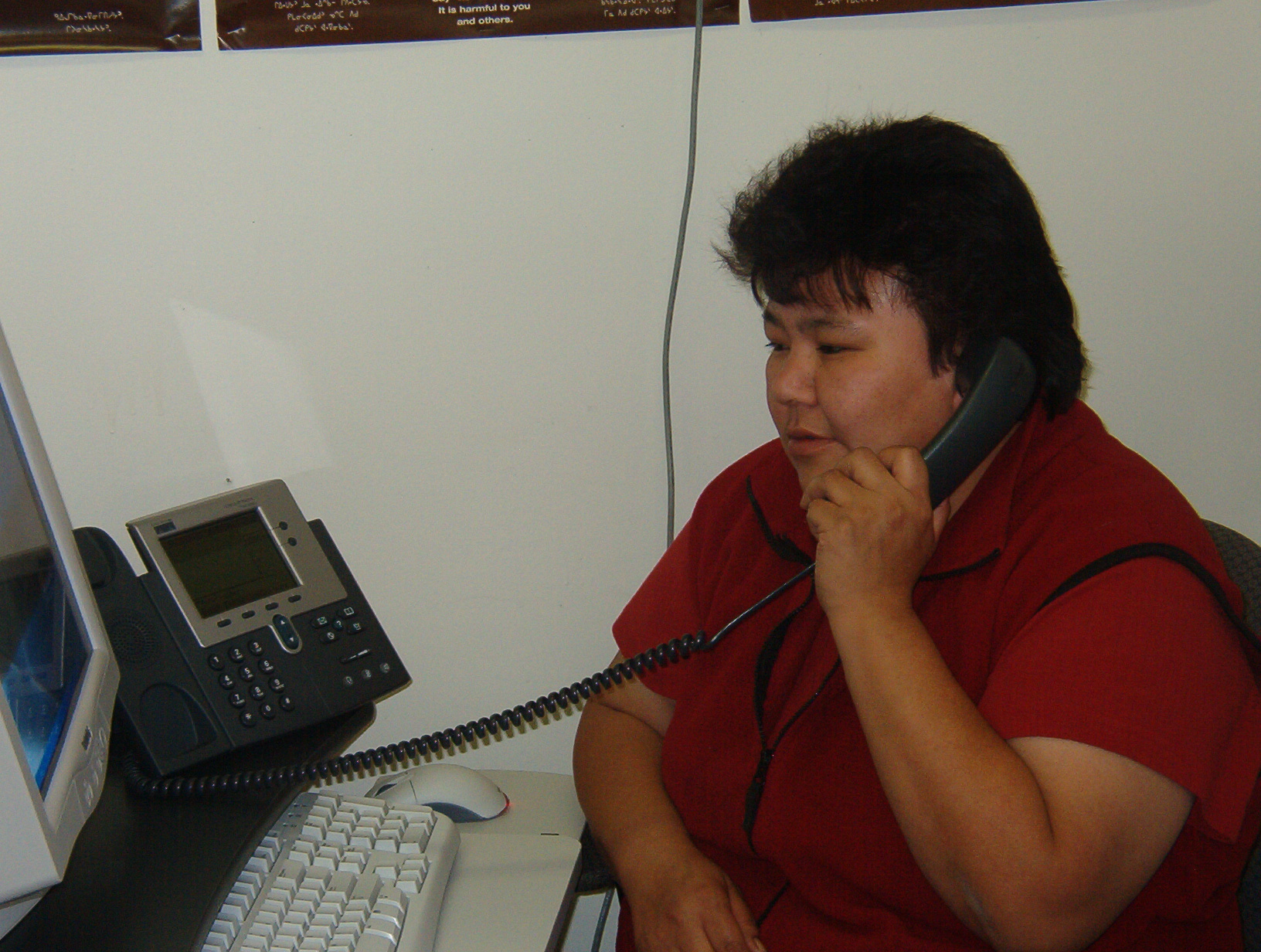 Caroline Keesic, Social Counsellor, for the school, with her new IP phone.