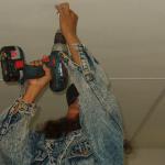 Janice Rae, drilling the finishing on the ceiling.
