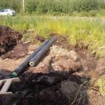 A picture of the pipes on the ground.