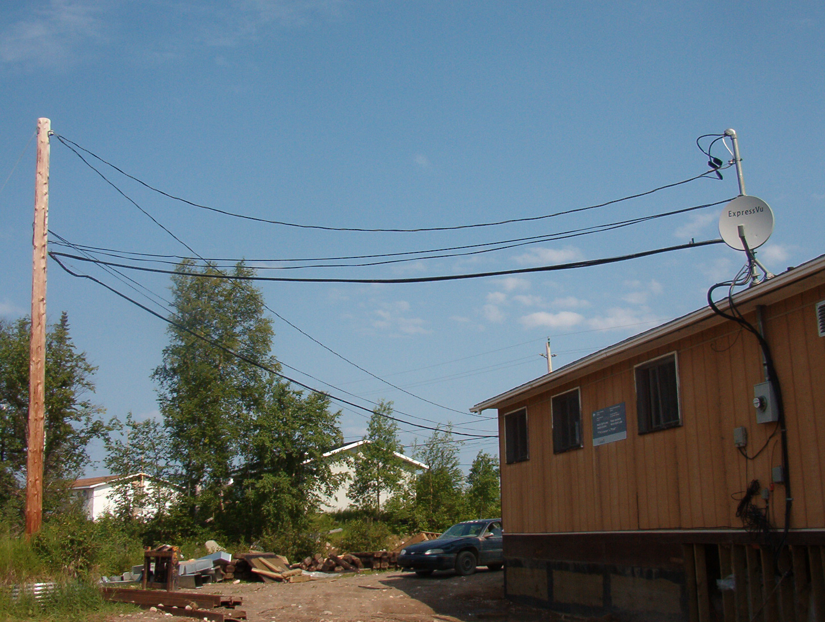 The wire that is hanging on the hydro poles.