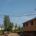 The wire that is hanging on the hydro poles.