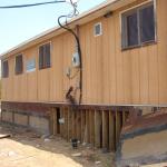 Workers are getting ready to jack up the building.  They are going to move it 20 to 40 feet over.