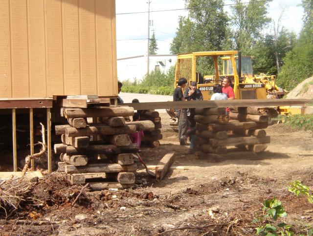 July 28. Here they are starting to jack up the building.