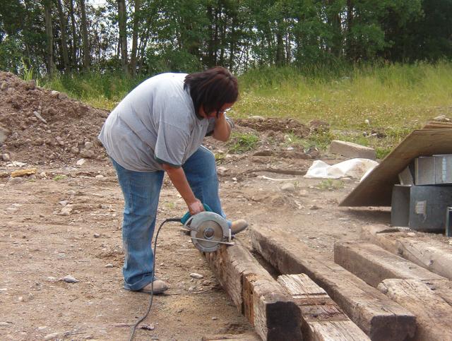 This young lady, has special talents.
She is a mother, and a hard worker.  See her holding the skill saw??  She is "Amazin