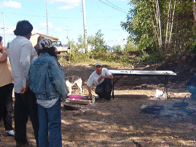 Kennedy Rae, one of the cooks who fried the fish in open fire.