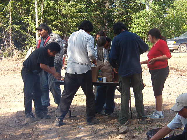 Cutting the potatoes, and going to take them to the community hall.