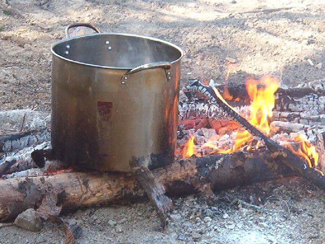 Making a pot of tea...  Notice the size of the pot??  But... outside door tea is GOOD....