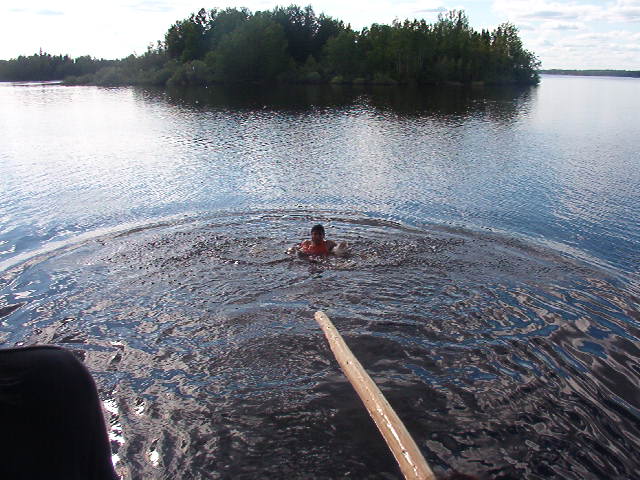 Tyler makes it to the end of the log, but that is with his sandals on.  :-)