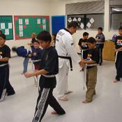 Here we see the class learning a low block.