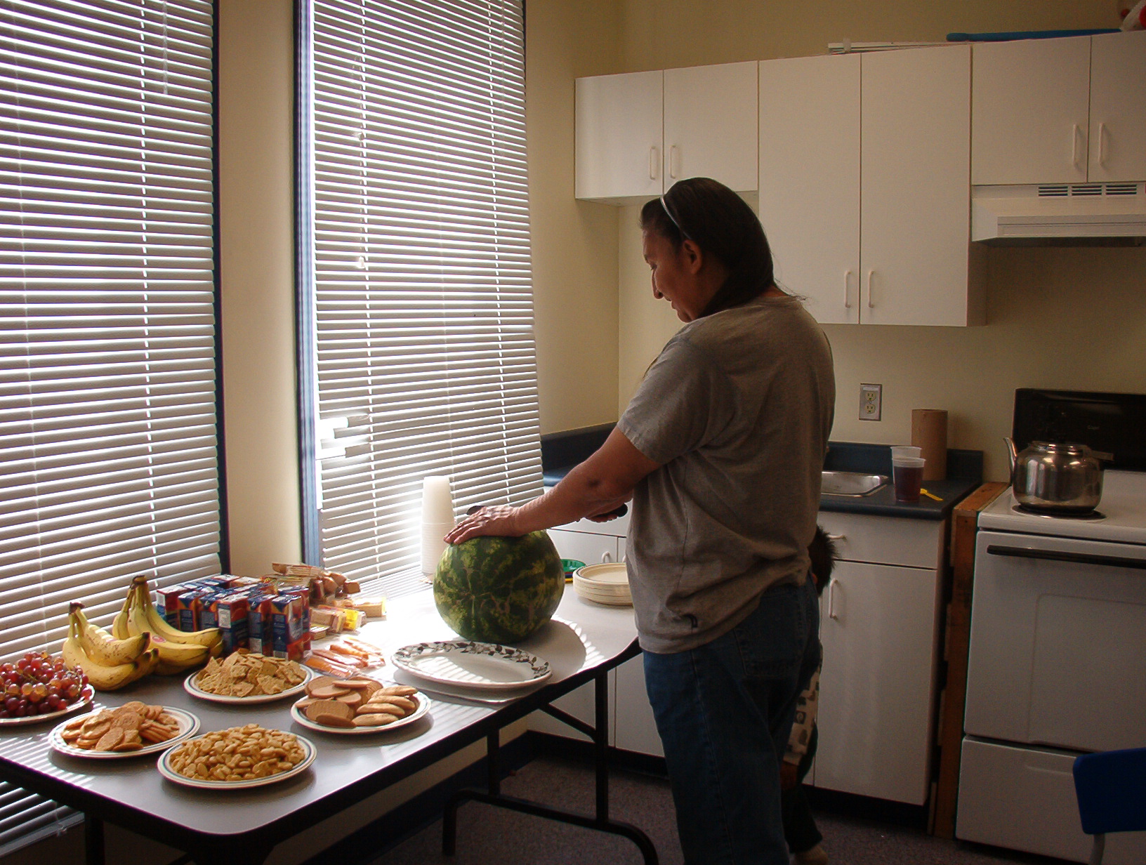 Here is Philomena cutting the watermelon 