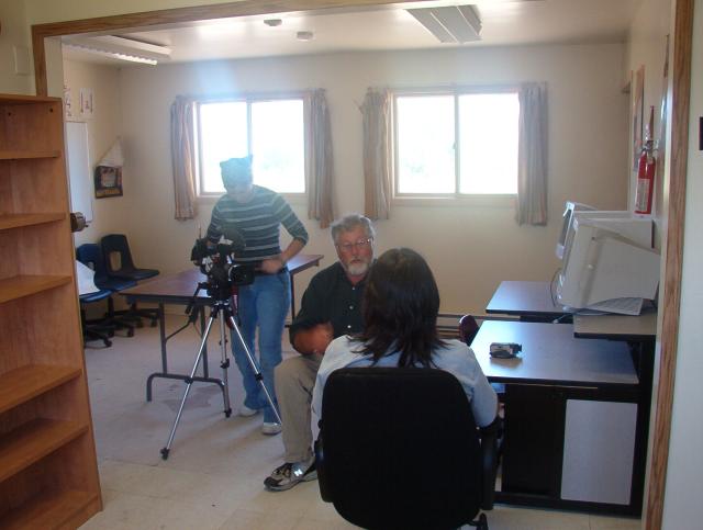 Darlene getting interviewed by Sandy, Quinn on camera