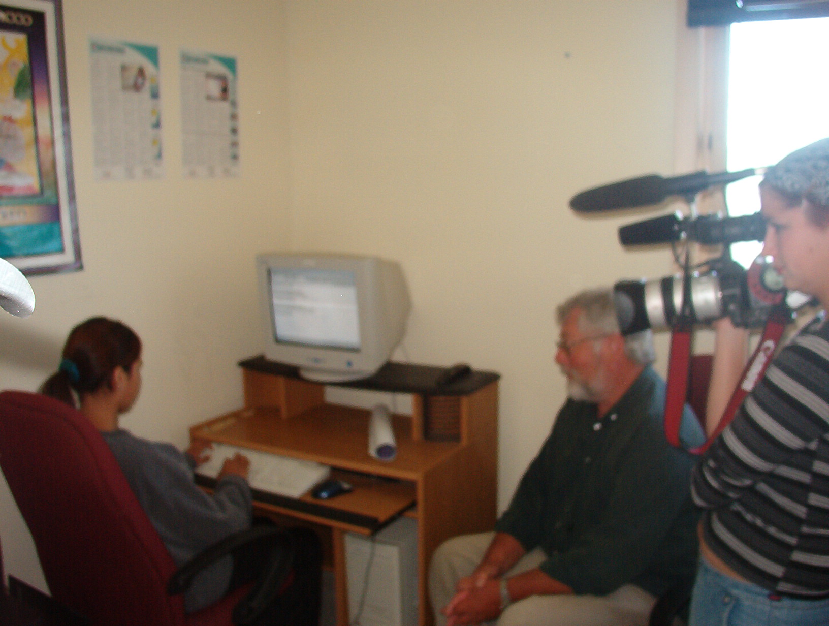 Josephine Rae getting interviewed by Sandy while she is on the computer