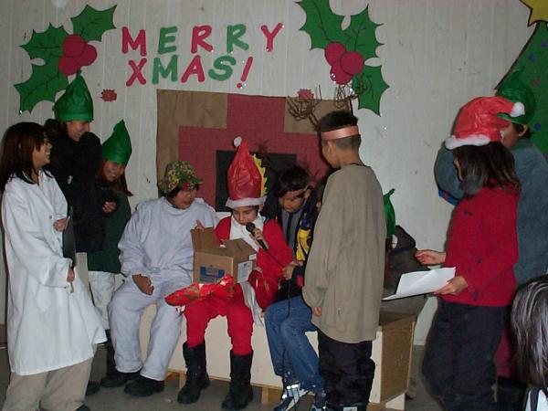 Santa opening his gift 