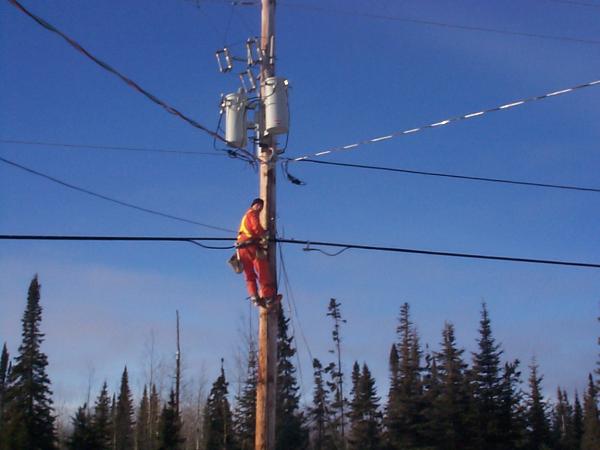 running the wires from the pole to the homes