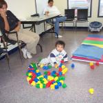 Our youngest one who came to the clinic, Jamie Rae and babysitter 
Nasen Kakegamic.