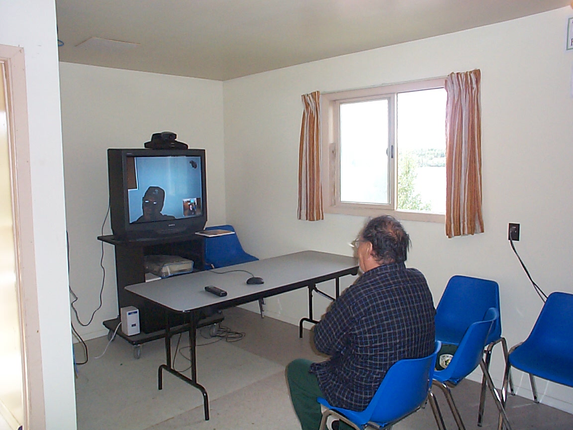 Johnny Rae visiting with Moyen Kakepetum
who was in Keewaywin.  The visit took place July 23, 2001.  

It was great seeing tw