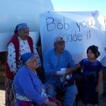 Connie Rae, Bob Rae, his god child shakes his hand, her name is Francine Rae, Sally is holding the banner, as one of the elders,