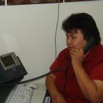 Caroline Keesic, Social Counsellor, for the school, with her new IP phone.