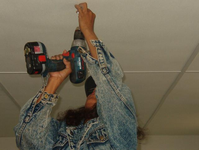 Janice Rae, drilling the finishing on the ceiling.